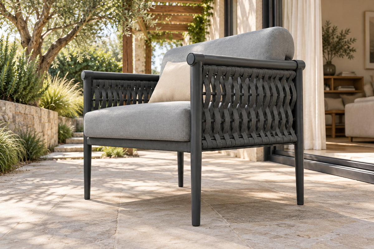 Formentera Lounge Chair, low near-side-profile lifestyle view