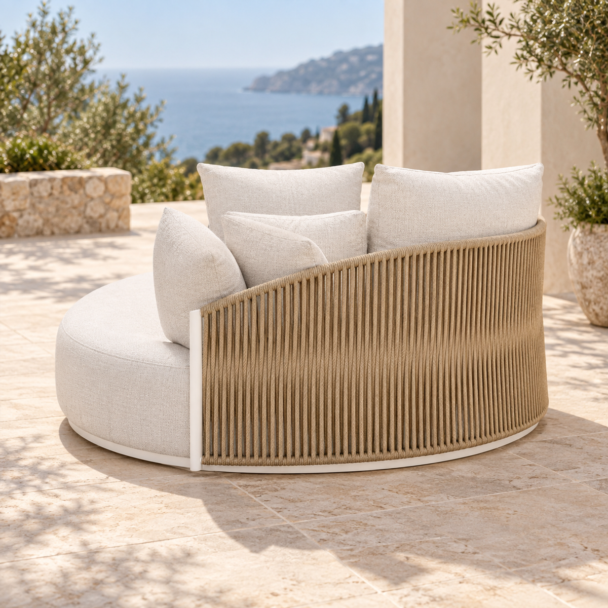 Lifestyle view: Ripple Sun Bed in Aluminium, outer side and rear on a coastal terrace