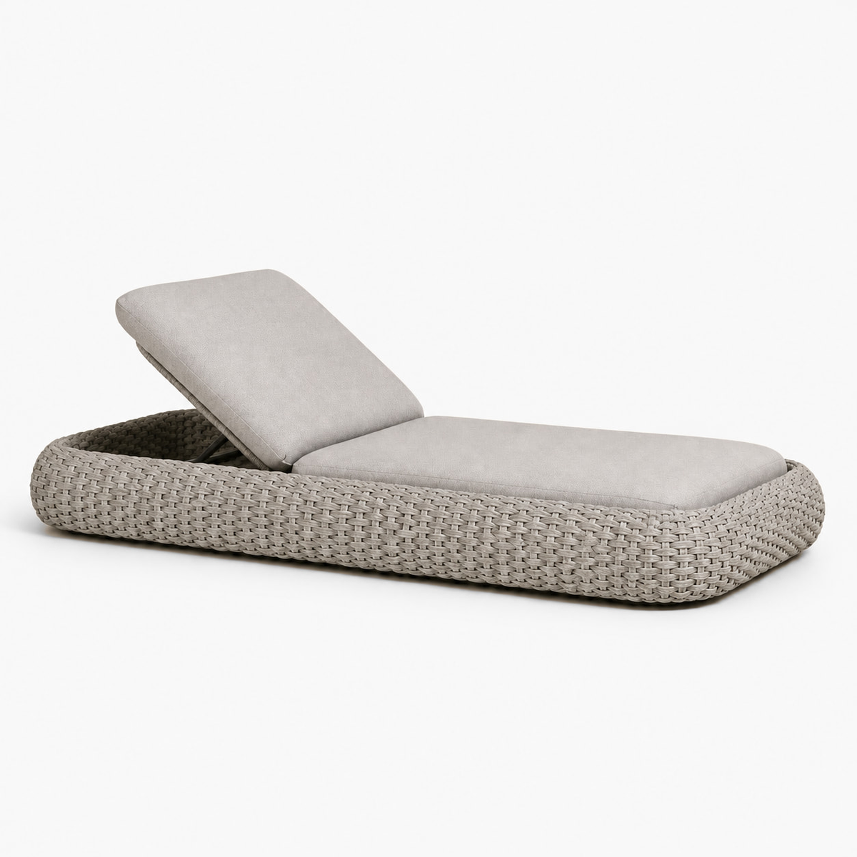 Sabbia Stone rope sun lounger with raised backrest and recessed rear well, studio view