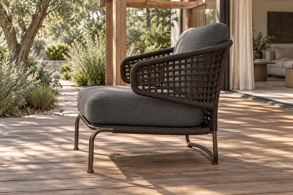 Ischia Lounge Chair, low near-side-profile lifestyle view