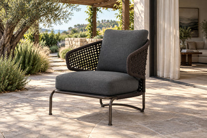 Ischia Lounge Chair, front-right three-quarter lifestyle view