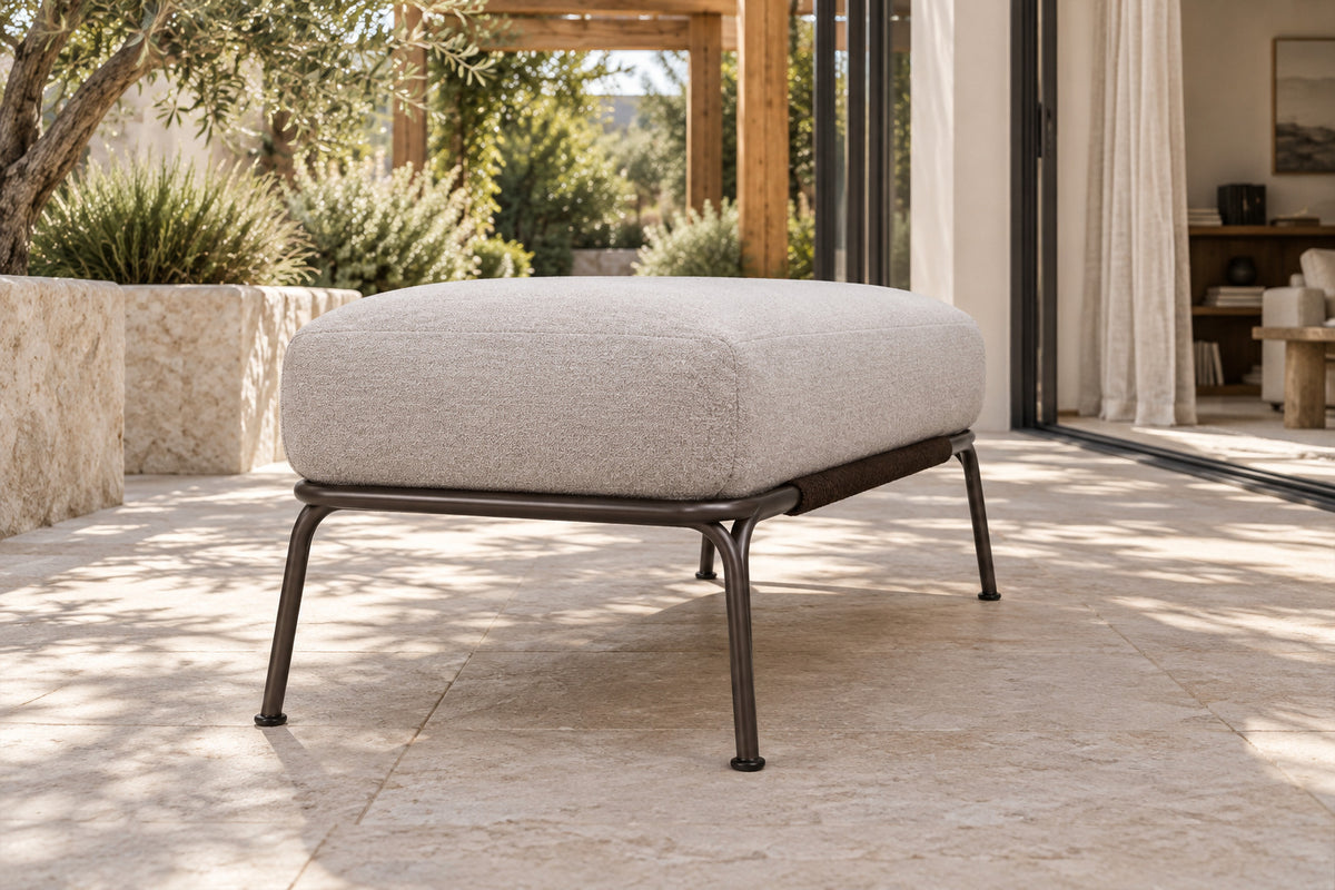 Ischia Ottoman, low near-side-profile lifestyle view