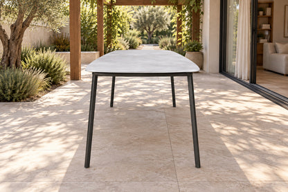 Otranto Dining Table, low near-side-profile lifestyle view