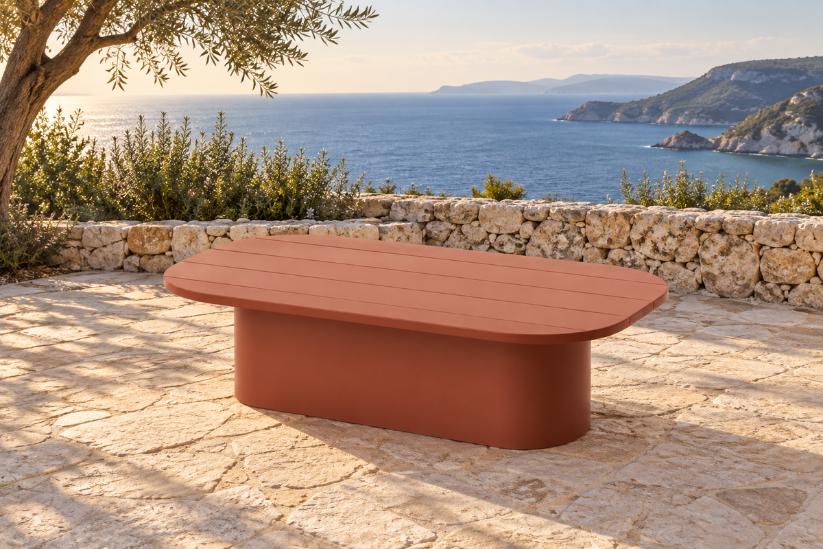 Lifestyle view: Aria aluminium coffee table on a coastal stone terrace