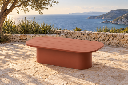 Lifestyle view: Aria aluminium coffee table on a coastal stone terrace
