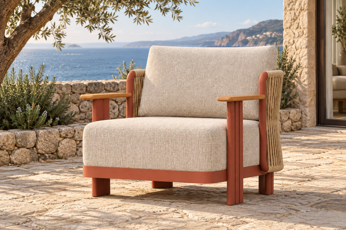 Lifestyle view: Aria aluminium lounge chair on a coastal stone terrace