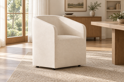 Lifestyle view: Ellison fabric dining armchair in a sunlit dining interior