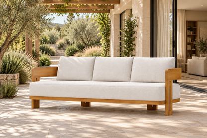 Lifestyle view: Serein teak sofa on a planted garden terrace