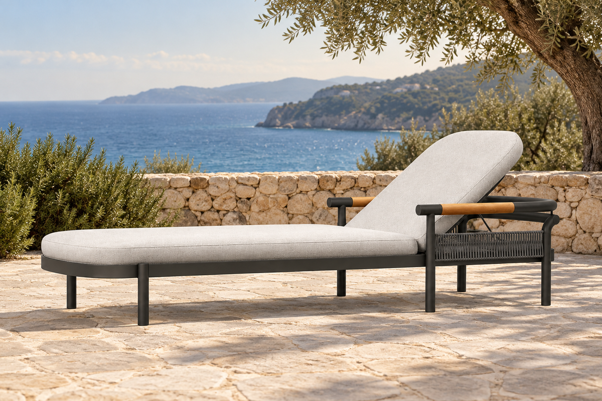 Lifestyle view: Zenia aluminium sun lounger on a coastal stone terrace