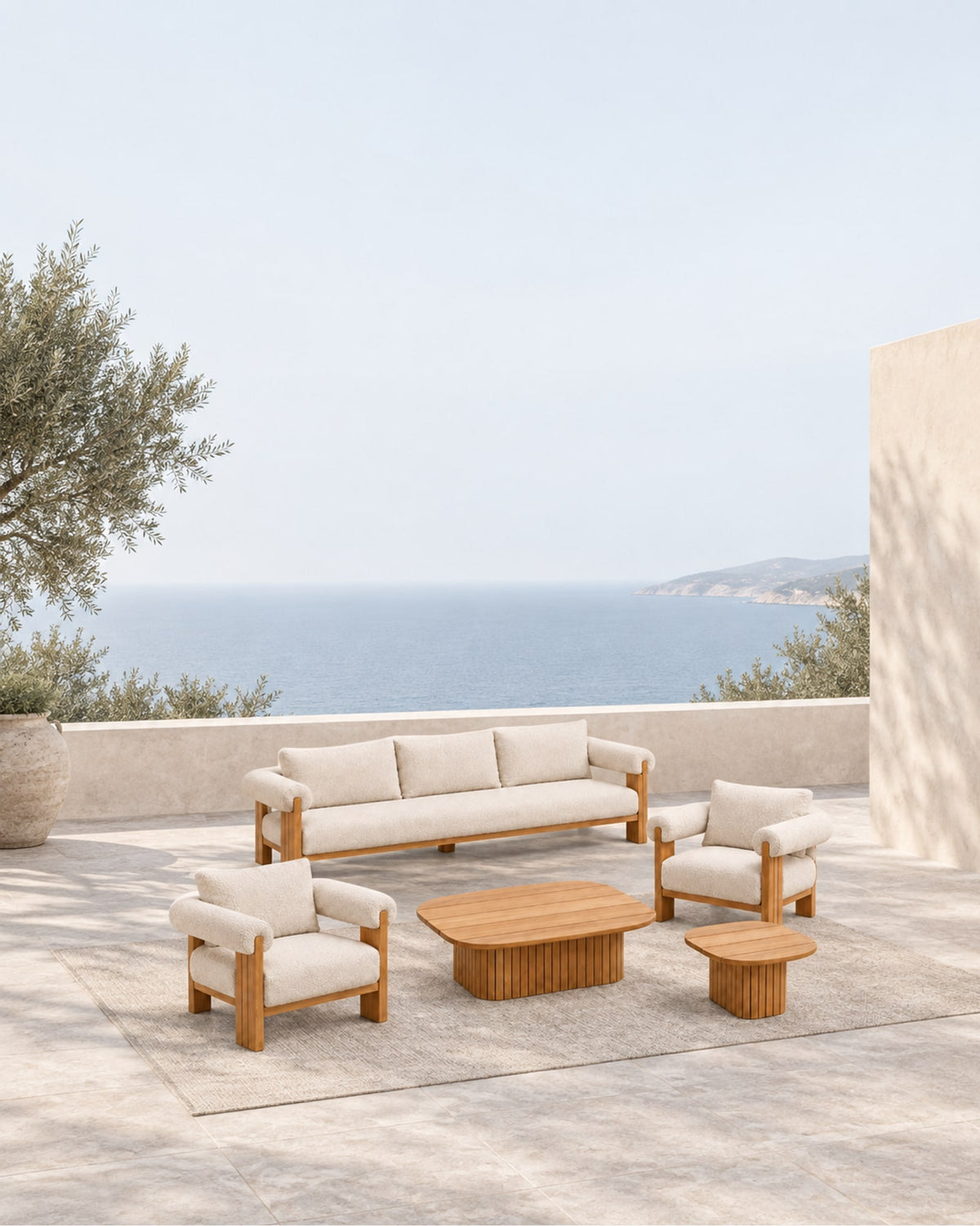 Ethereal Outdoor Sofa Set in Teak in a styled setting