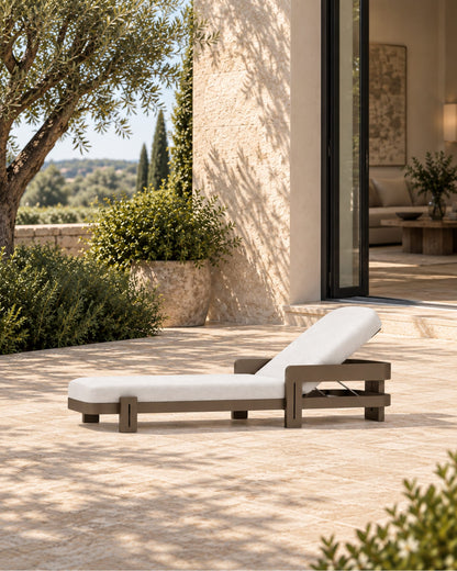 Serein Sun Lounger in Aluminium in a styled setting