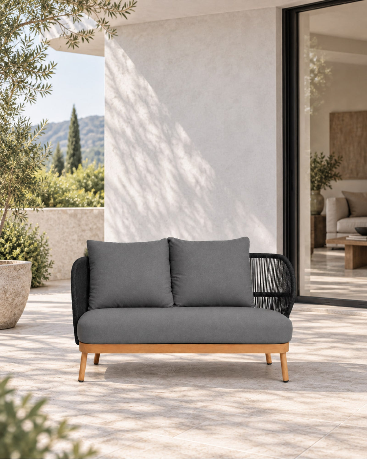 Menorca Two-Seat Sofa in a styled setting