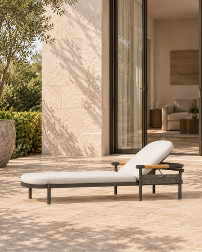 Zenia Sun Lounger in Aluminium in a styled setting