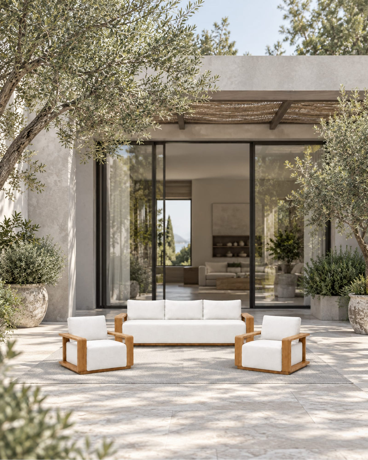 Grace Outdoor Sofa Set in Teak in a styled setting