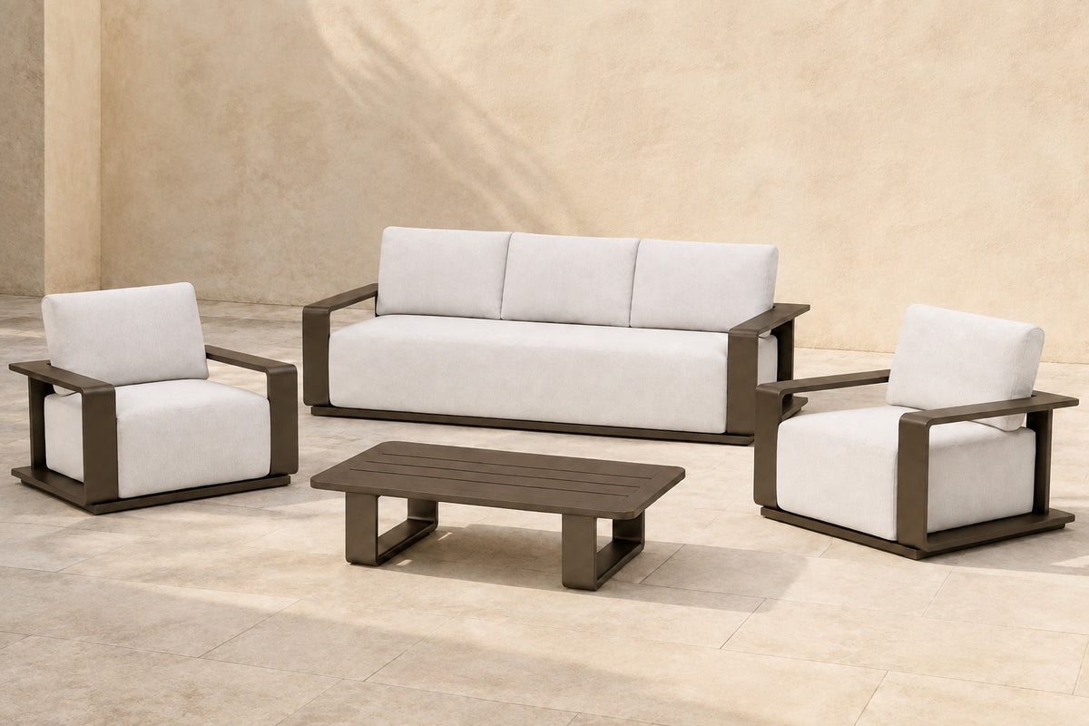 Grace Outdoor Sofa Set in Aluminium, photographed in a quiet outdoor courtyard