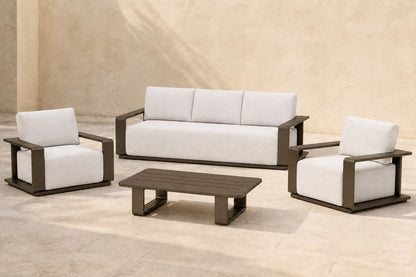 Grace Outdoor Sofa Set in Aluminium, photographed in a quiet outdoor courtyard