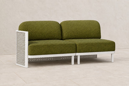 Luna Modular Two-Seat in Aluminium, photographed in a quiet outdoor courtyard