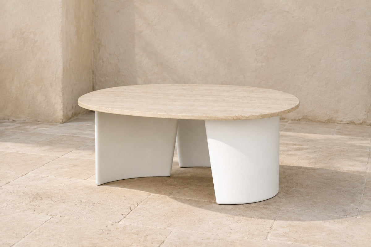 Luna Side Table in Aluminium, photographed in a quiet outdoor courtyard