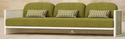 Luna Sofa in Aluminium, photographed in a quiet outdoor courtyard