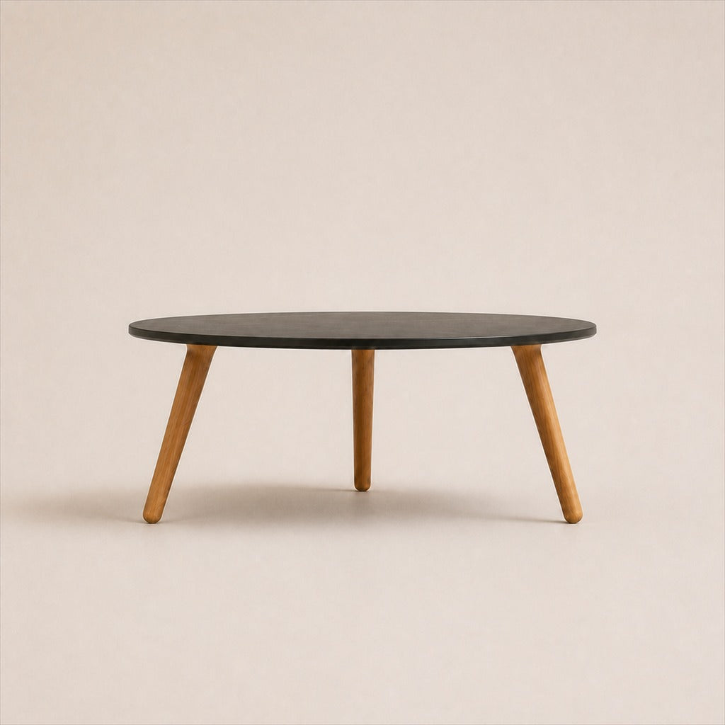 Marisol 70 cm coffee table with dark solid circular top and three timber legs, side view