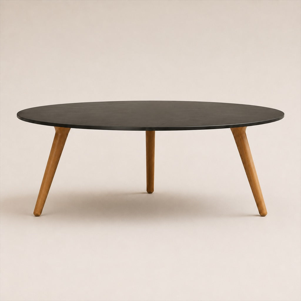 Marisol 90 cm coffee table with dark solid circular top and three timber legs, side view