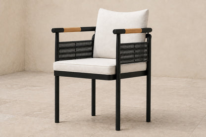 Zenia Dining Chair in Aluminium, photographed in a quiet outdoor courtyard
