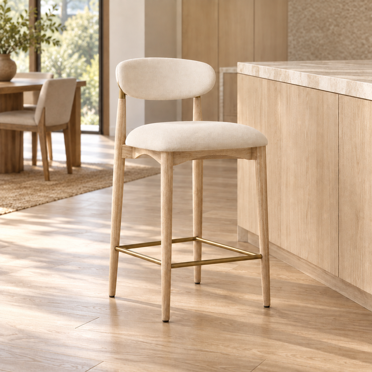 Lifestyle view: Arno Fabric Bar and Counter Stool beside a kitchen island in daylight