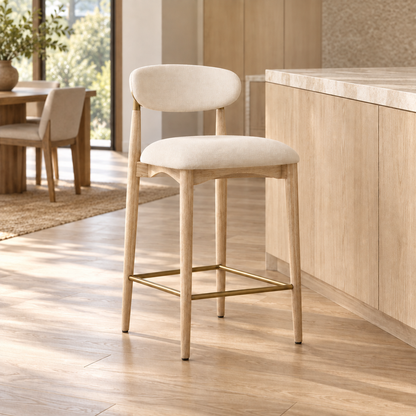 Lifestyle view: Arno Fabric Bar and Counter Stool beside a kitchen island in daylight