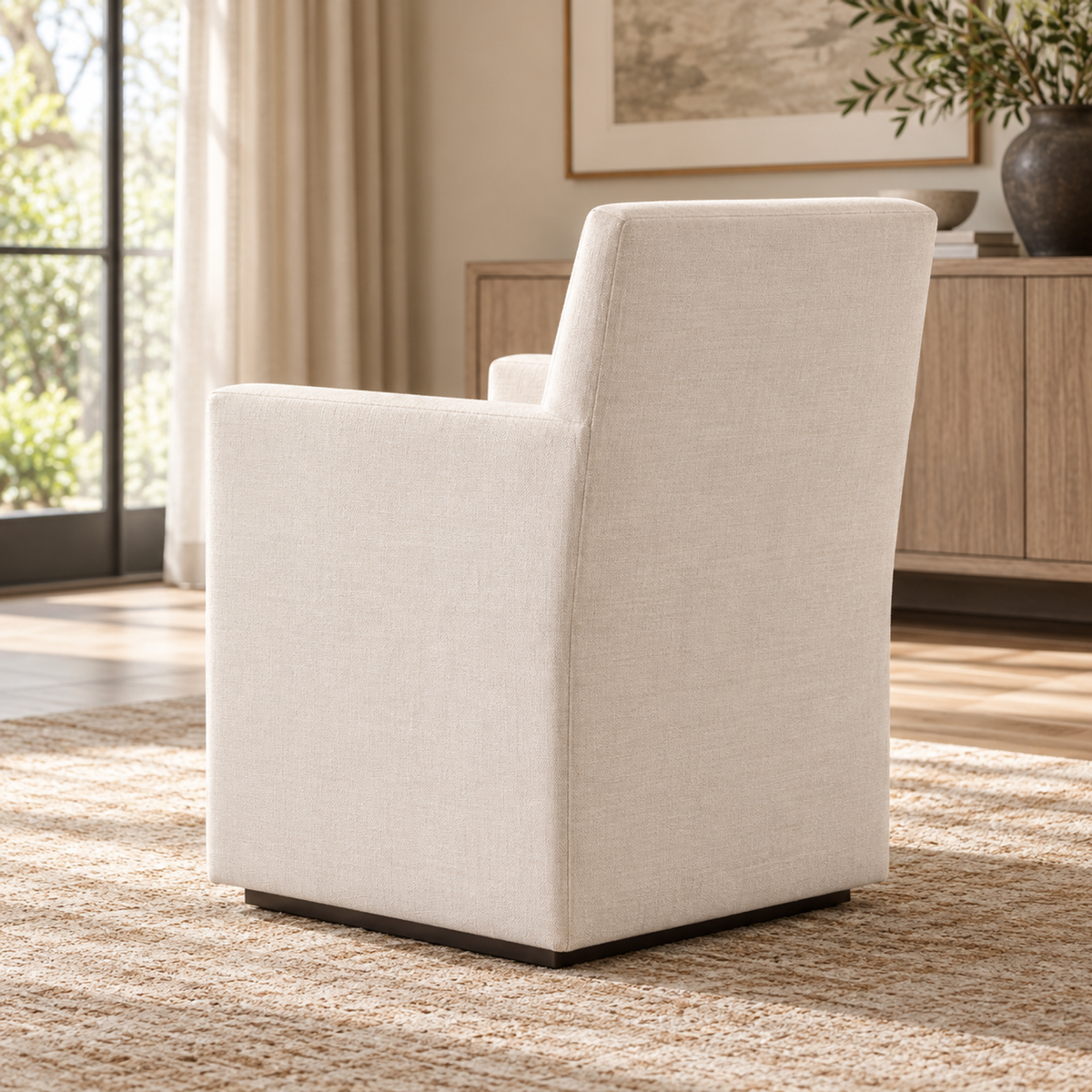Lifestyle view: Ellison Track Arm Fabric Dining Armchair, photographed in a furnished dining room