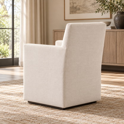 Lifestyle view: Ellison Track Arm Fabric Dining Armchair, photographed in a furnished dining room
