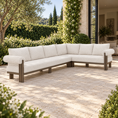 Lifestyle view: Ethereal L-Sectional in Aluminium, left three-quarter view beside a furnished garden home