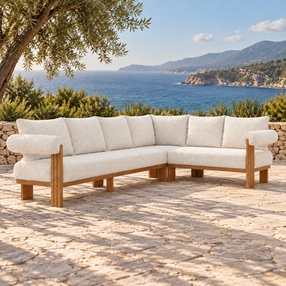Lifestyle view: Ethereal L-Sectional in Teak, three-quarter view on a coastal stone terrace