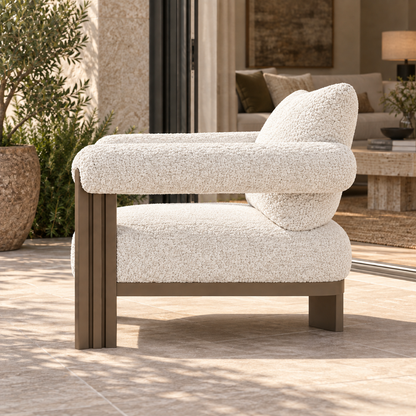 Ethereal aluminium lounge chair, side profile beside a furnished living room