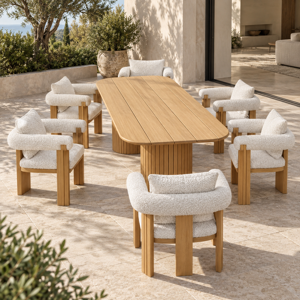 Ethereal teak dining set, short-end view of the table and six chairs beside a furnished home
