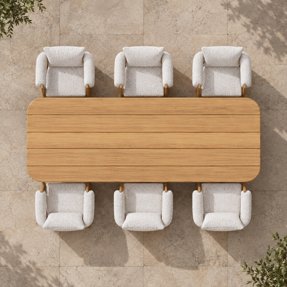 Ethereal Outdoor Dining Set in Teak, overhead view of the table and six chairs on a stone terrace