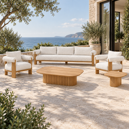 Lifestyle view: Ethereal Outdoor Sofa Set in Teak, low frontal three-quarter view on a coastal home terrace