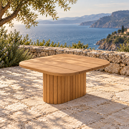 Lifestyle view: Ethereal Side Table in Teak, low side-oriented view on a coastal stone terrace