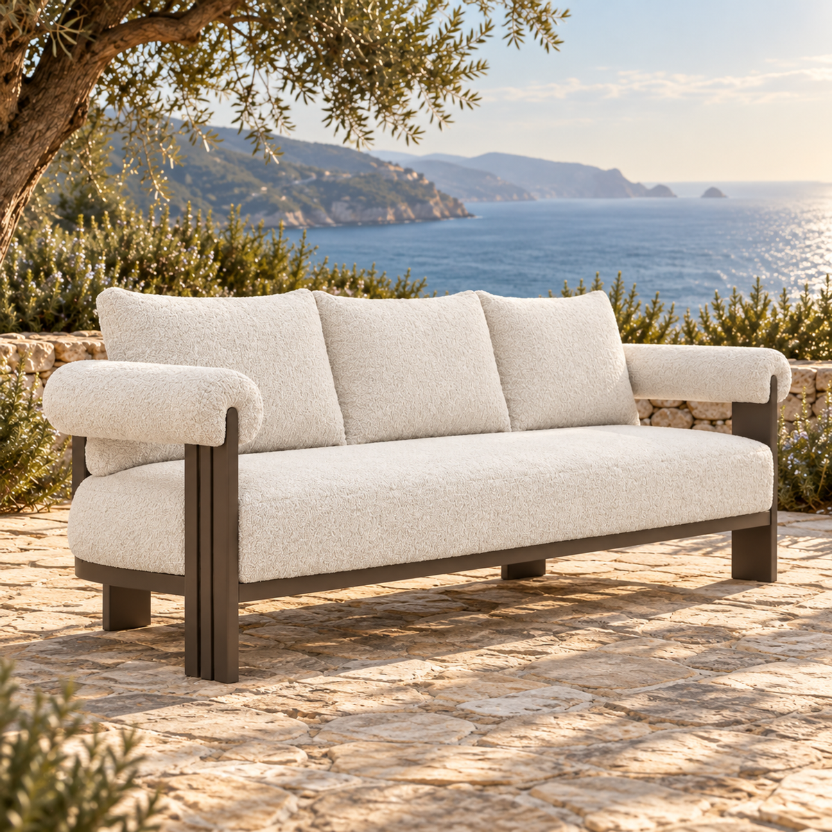 Lifestyle view: Ethereal Sofa in Aluminium, opposite three-quarter view on a coastal terrace