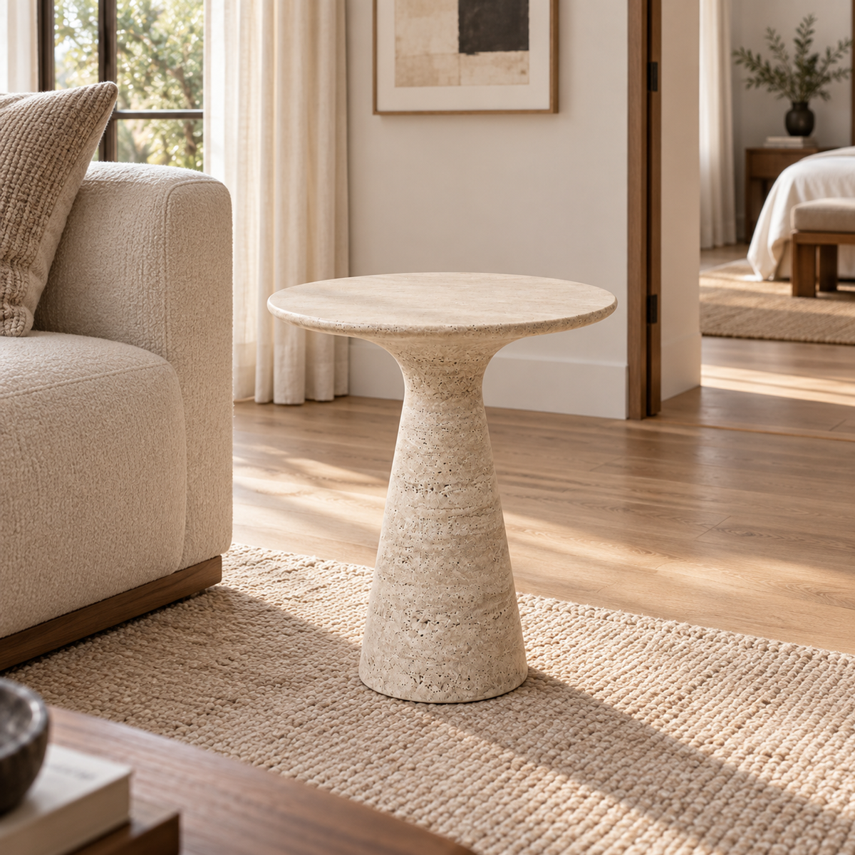 Lifestyle view: Gio Stone Round Side Table in a furnished setting