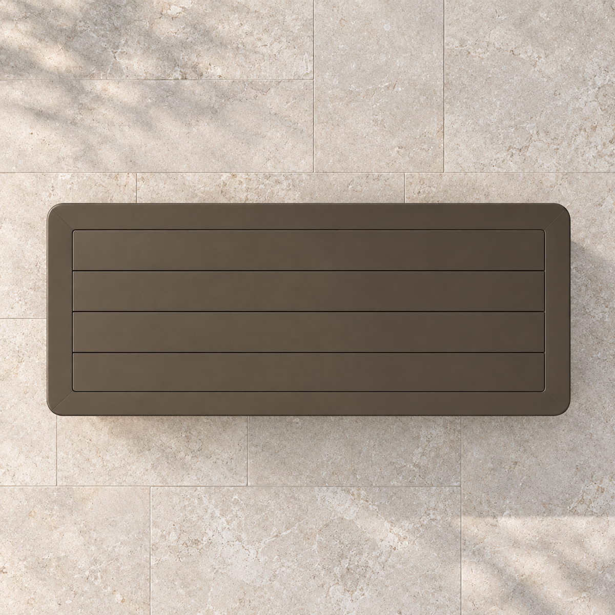 Grace aluminium coffee table, overhead view on a stone terrace