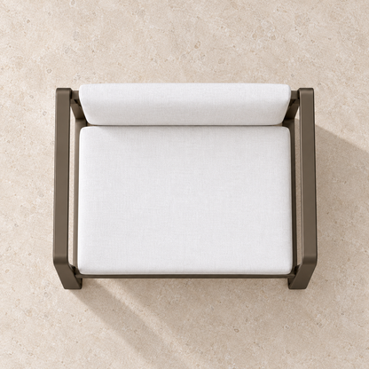 Grace aluminium dining chair, overhead view on a stone terrace