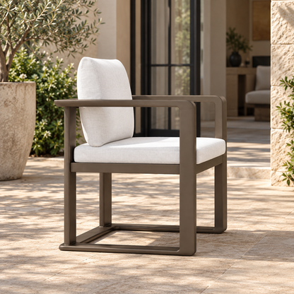 Grace aluminium dining chair, strong left side view on a furnished home terrace