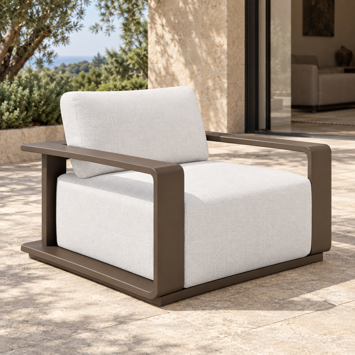 Grace aluminium lounge chair, left three-quarter view on a furnished home terrace