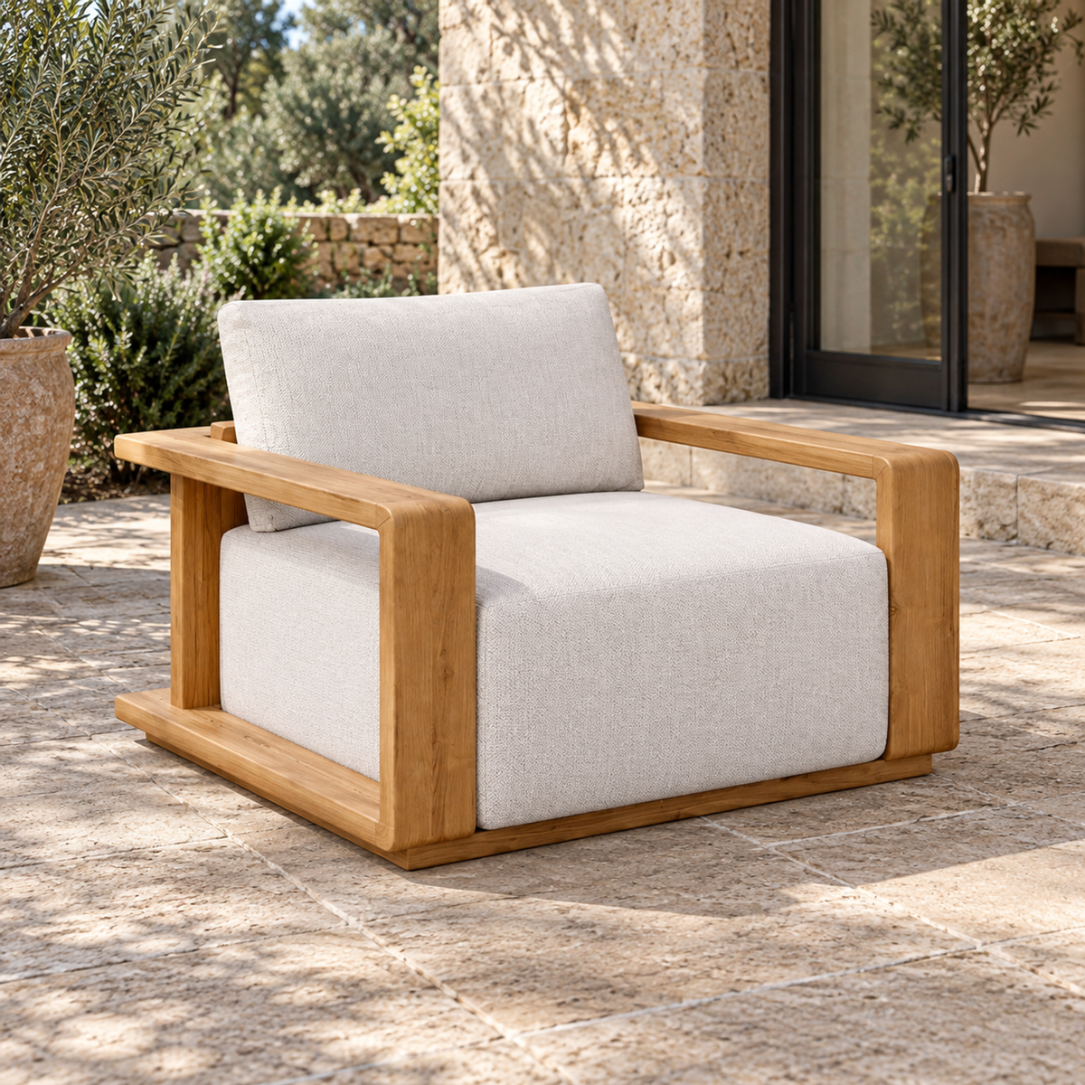 Grace Lounge Chair in Teak, elevated front-left view on a home terrace