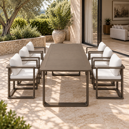 Grace aluminium dining table and six chairs, short-end view on a furnished garden terrace