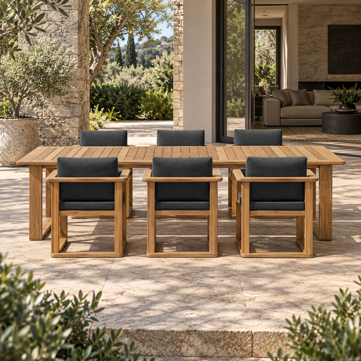 Grace teak dining set, straight front view with six chairs beside a furnished terrace