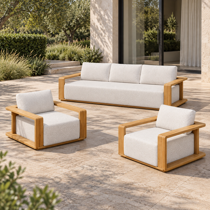 Lifestyle view: Grace Outdoor Sofa Set in Teak, elevated right diagonal in a landscaped home courtyard