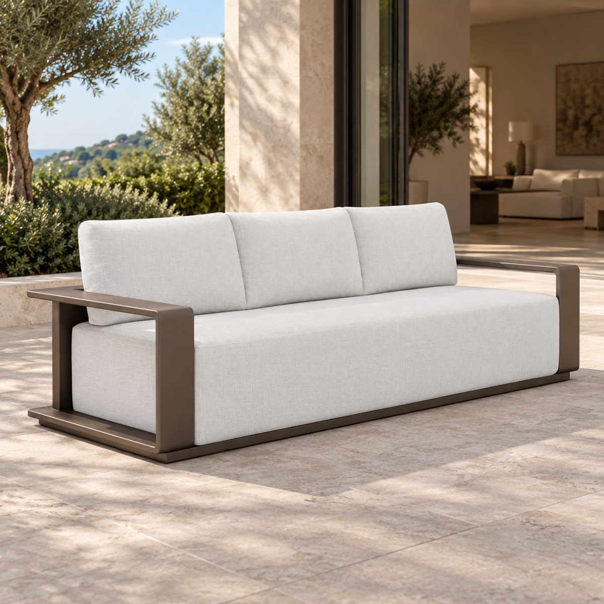 Grace aluminium sofa, left three-quarter view on a furnished coastal terrace