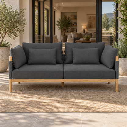 Lifestyle view: Ithaca Sofa, 185 cm, photographed in a quiet outdoor courtyard