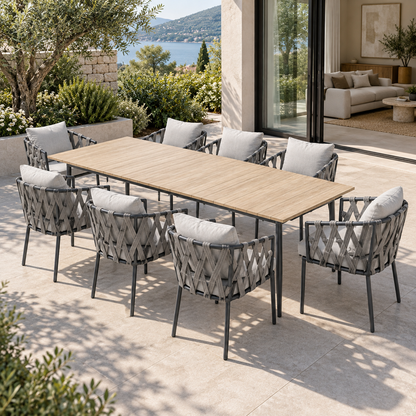 Lifestyle view: Naxos Outdoor Dining Set, photographed in a quiet outdoor courtyard